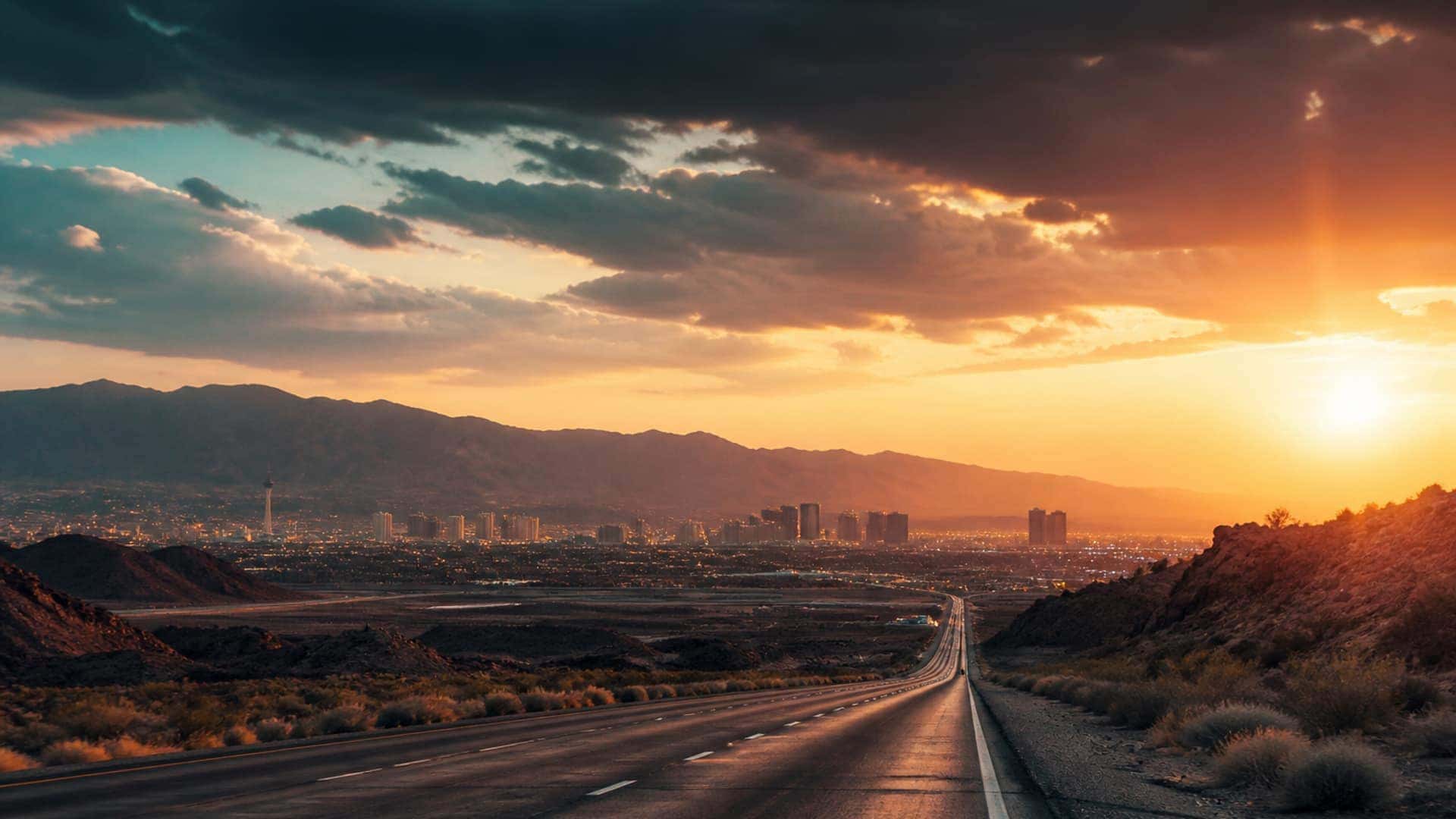Desert highway toward the Las Vegas Valley at dusk